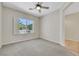 Bright bedroom with plush carpets and a window with plantation shutters that provide ample light at 2349 Orangeburg Pl, Henderson, NV 89044