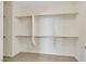 Spacious walk-in closet featuring adjustable shelving and neutral carpeting at 2349 Orangeburg Pl, Henderson, NV 89044