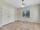 Bright dining room features tile floors, a window with shutters and view, and double-door storage closet at 2349 Orangeburg Pl, Henderson, NV 89044