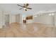 Open layout with tile flooring seamlessly connecting the living room and kitchen at 2349 Orangeburg Pl, Henderson, NV 89044