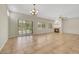 Expansive living room featuring a fireplace, neutral colors and plantation shutters at 2349 Orangeburg Pl, Henderson, NV 89044