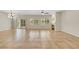 Open concept living room boasts tile floors, a fireplace, recessed lighting and access to the backyard at 2349 Orangeburg Pl, Henderson, NV 89044