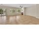 Spacious living room with a fireplace, tile floors, and bright natural light at 2349 Orangeburg Pl, Henderson, NV 89044