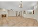 Spacious living room featuring a fireplace, tile floors, and open floor plan at 2349 Orangeburg Pl, Henderson, NV 89044