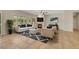 Bright living room showcasing stylish furniture, a cozy fireplace, and natural light streaming through the windows at 2349 Orangeburg Pl, Henderson, NV 89044