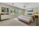 Serene main bedroom featuring a comfortable bed, soft neutral tones, and bright natural light from shuttered windows at 2349 Orangeburg Pl, Henderson, NV 89044