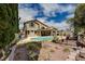 Expansive home backyard with a pool, and mature landscaping at 3055 Whispering Crest Dr, Henderson, NV 89052