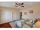 Comfortable bedroom featuring wood flooring and large closet doors, offering ample storage space at 3055 Whispering Crest Dr, Henderson, NV 89052