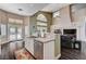 Bright kitchen features granite countertops, stainless steel appliances, and a view of the living room and backyard at 3055 Whispering Crest Dr, Henderson, NV 89052
