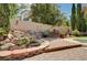 Beautiful landscaped backyard with waterfall feature and brick paving at 3055 Whispering Crest Dr, Henderson, NV 89052