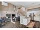 Open-concept living space with kitchen and fireplace, staircase, high ceilings and wood floors at 3055 Whispering Crest Dr, Henderson, NV 89052