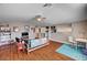 The bonus room has laminate floors, a ceiling fan, and versatile furniture arrangement at 3055 Whispering Crest Dr, Henderson, NV 89052