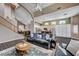Open-concept living room flows into kitchen; features wood floors, staircase, high ceilings, and lots of natural light at 3055 Whispering Crest Dr, Henderson, NV 89052