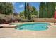 Private backyard pool with a spa, surrounded by lush landscaping for serene outdoor living at 3055 Whispering Crest Dr, Henderson, NV 89052