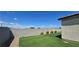Landscaped backyard featuring an artificial lawn and mountain views at 314 W Winston Ln, Indian Springs, NV 89018