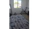 Cozy bedroom with a large window and a cycling exercise bike, ideal for workouts at 314 W Winston Ln, Indian Springs, NV 89018