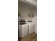 Efficient laundry area includes modern washer and dryer, plus convenient shelving at 314 W Winston Ln, Indian Springs, NV 89018