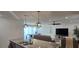 View from the kitchen reveals an open-concept floor plan with views to dining and living areas at 314 W Winston Ln, Indian Springs, NV 89018