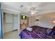 Cozy bedroom featuring wallpapered walls, a ceiling fan, closet, and a charming reading desk at 3141 E Katie Ave, Las Vegas, NV 89121