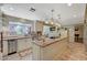 A spacious kitchen featuring granite countertops, stainless steel appliances, and a large window overlooking the outdoors at 3141 E Katie Ave, Las Vegas, NV 89121