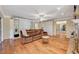Inviting living room with hardwood floors, a comfortable sofa, and built-in storage at 3141 E Katie Ave, Las Vegas, NV 89121