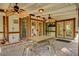 Inviting covered patio with brick pavers, ceiling fans and a dining table at 3141 E Katie Ave, Las Vegas, NV 89121