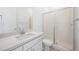 Modern bathroom with sleek vanity, a frameless glass shower, and neutral tones, offering a spa-like experience at 350 Tigullio Ave, Henderson, NV 89011