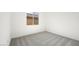 Bright bedroom with a window and neutral carpet at 350 Tigullio Ave, Henderson, NV 89011