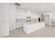 Bright kitchen with white cabinets, large island, and modern appliances, creating a clean and inviting space at 350 Tigullio Ave, Henderson, NV 89011
