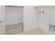 Functional laundry room with tiled flooring and ample space, offering convenience and practicality at 350 Tigullio Ave, Henderson, NV 89011