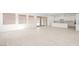 Open-concept living space with tile floors and modern kitchen at 350 Tigullio Ave, Henderson, NV 89011