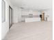 Open-concept living space with tile floors and modern kitchen at 350 Tigullio Ave, Henderson, NV 89011