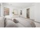 Bright primary bedroom featuring neutral tones, contemporary decor, and an en-suite bathroom at 350 Tigullio Ave, Henderson, NV 89011