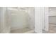 Modern bathroom showcasing a glass-enclosed shower with tiled walls and a built-in bench, designed for relaxation at 350 Tigullio Ave, Henderson, NV 89011