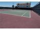 Community tennis court surrounded by a secure fence, near desert landscaping at 3550 Bay Sands Dr # 2063, Laughlin, NV 89029