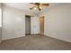 Bedroom features neutral carpet, an open door to the bathroom, and closet at 3630 Daisy Field Dr, North Las Vegas, NV 89032