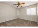 Bedroom featuring neutral carpet, a ceiling fan, and a bright window at 3630 Daisy Field Dr, North Las Vegas, NV 89032