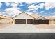Charming single-story home featuring a two-car garage and a well-maintained front yard in a sunny neighborhood at 3630 Daisy Field Dr, North Las Vegas, NV 89032