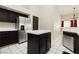 This kitchen features stainless steel appliances, an island, and plenty of room for cooking at 3630 Daisy Field Dr, North Las Vegas, NV 89032