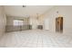 Bright living room features high ceilings, tile flooring, and a modern pendant light fixture at 3630 Daisy Field Dr, North Las Vegas, NV 89032