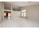 Spacious living room featuring tile floors, high ceilings, and natural light at 3630 Daisy Field Dr, North Las Vegas, NV 89032