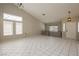 Bright living room boasts high ceilings, decorative windows, and tile flooring for a modern, spacious feel at 3630 Daisy Field Dr, North Las Vegas, NV 89032