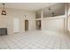 Expansive living room with tile floors, high ceilings, and neutral color palette at 3630 Daisy Field Dr, North Las Vegas, NV 89032