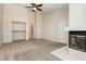 Large primary bedroom with neutral carpet, a fireplace, and a large closet at 3630 Daisy Field Dr, North Las Vegas, NV 89032