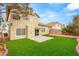 Lush backyard showcases a well-maintained lawn and concrete patio, offering a private outdoor space at 3709 Misty Falls St, Las Vegas, NV 89129