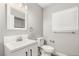 This modern bathroom features a single sink vanity, toilet, and framed mirror at 3709 Misty Falls St, Las Vegas, NV 89129