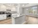 Bright kitchen featuring stainless steel appliances, granite countertops, and ample cabinet space at 3709 Misty Falls St, Las Vegas, NV 89129