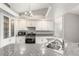 Stylish kitchen featuring granite countertops, stainless steel appliances, and plenty of cabinet storage at 3709 Misty Falls St, Las Vegas, NV 89129