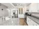 Modern kitchen with granite countertops, stainless steel appliances, and abundant storage cabinets at 3709 Misty Falls St, Las Vegas, NV 89129