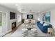 Bright living room featuring a fireplace, recessed lights, a ceiling fan, and modern furniture at 3709 Misty Falls St, Las Vegas, NV 89129